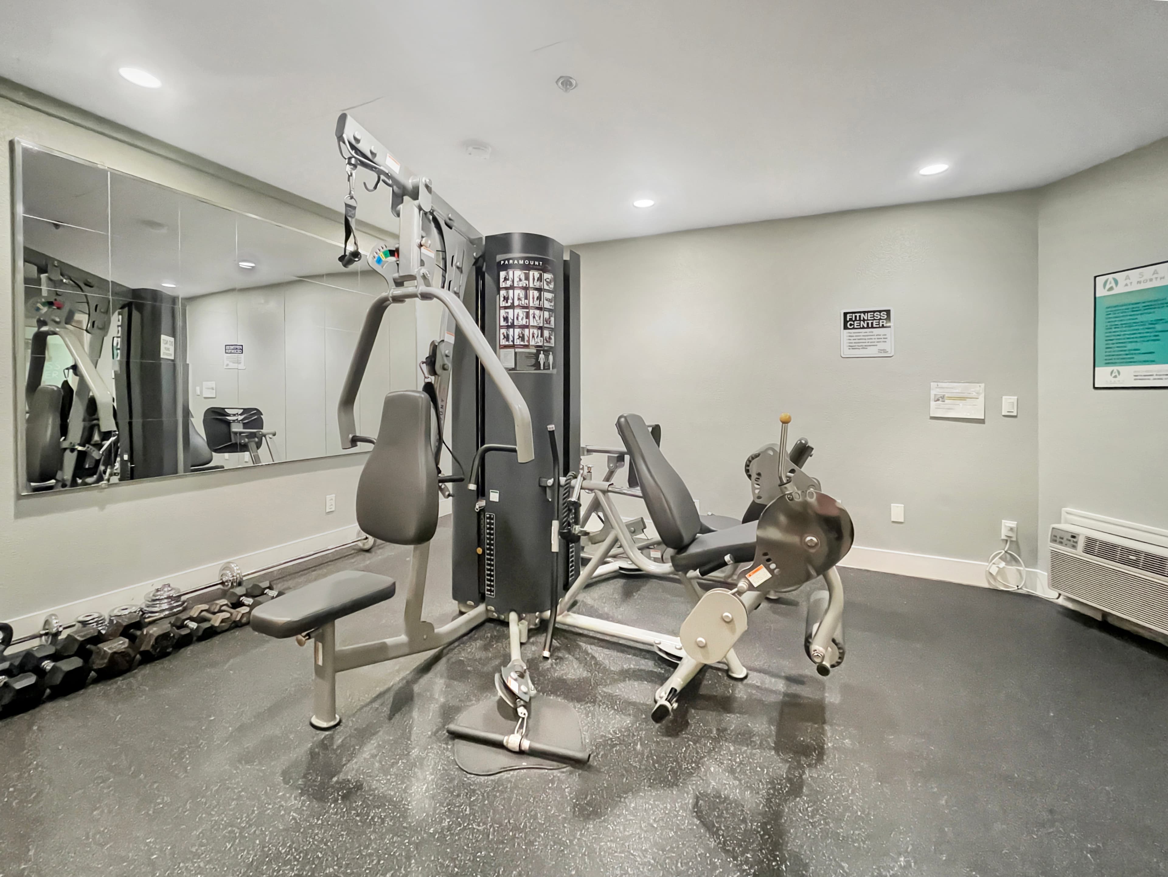 Asana at North Park fitness center with cable machine, benches and free weights